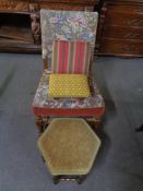 A carved oak tapestry armchair and three various footstools