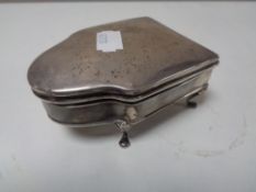 A silver ring box of raise feet bearing Birmingham hall marks