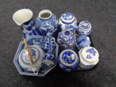 A tray of blue and white oriental style china including teapots, caddies,