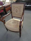 A scroll arm armchair in tapestry fabric