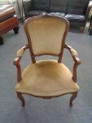 A beech framed salon chair in gold dralon