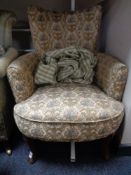 A 20th century tapestry upholstered armchair