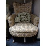 A 20th century tapestry upholstered armchair