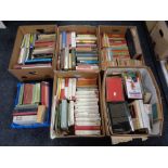 Five boxes and a crate of hardbacked and other books, novels,