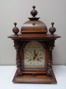 A walnut-cased Junghans eight day bracket clock.