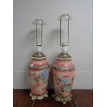 A pair of early 20th century Chinese floral pattern vases converted to table lamps on brass bases
