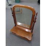 An antique mahogany dressing table mirror