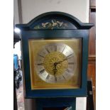 A 20th century hand painted longcase clock with brass dial