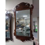 A Victorian mahogany Chippendale style wall mirror.