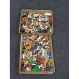 Two trays of plastic soldiers and animal figures,