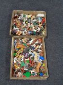 Two trays of plastic soldiers and animal figures,