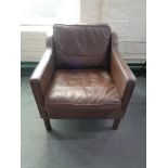 A mid 20th century Danish brown leather armchair