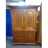 An antique walnut cocktail cabinet