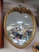 A Victorian composite frame heart shaped mirror.