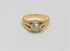 An 18ct gold solitaire diamond ring, the cushion cut stone weighing approximately 1.