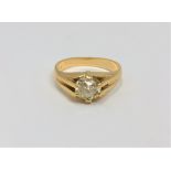 An 18ct gold solitaire diamond ring, the cushion cut stone weighing approximately 1.