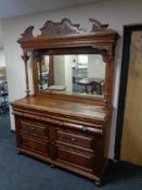 A late Victorian oak mirror backed sideboard