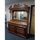 A late Victorian oak mirror backed sideboard