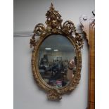 A Victorian composite frame oval mirror.