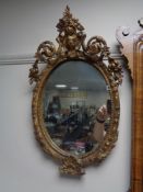 A Victorian composite frame oval mirror.