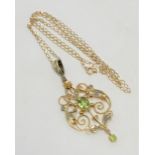 A 9ct gold Art Nouveau peridot and seed pearl pendant on chain