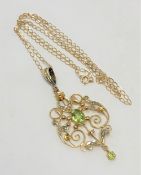 A 9ct gold Art Nouveau peridot and seed pearl pendant on chain