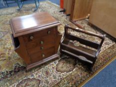 A mahogany storage cabinet fitted with four drawers together with a magazine rack