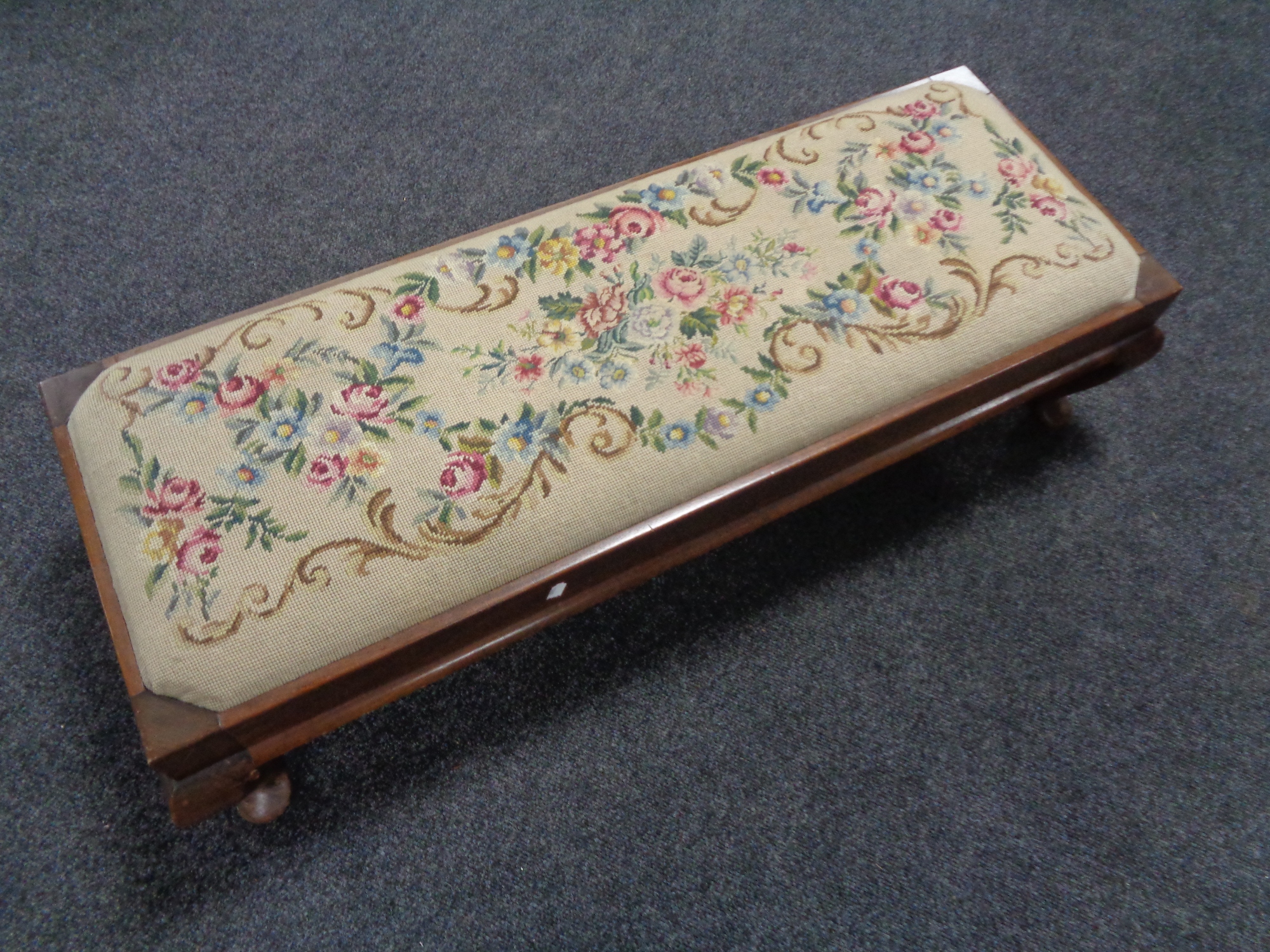 An Edwardian mahogany tapestry duet footstool