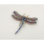 A fine sapphire, ruby and diamond brooch modelled as a dragonfly,