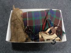 A box of fur and leather gauntlets,