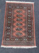 A fringed Persian style hearth rug