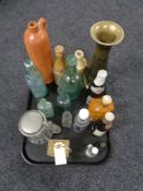 A tray of antique glass and stoneware bottle, brass carriage clock,