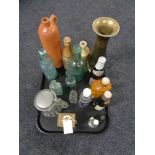 A tray of antique glass and stoneware bottle, brass carriage clock,