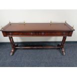 A reproduction mahogany low table fitted with two drawers