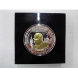 A cased Winston Churchill silver plated commemorative £5 coin