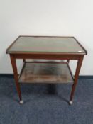 An inlaid mahogany two tier trolley