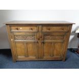 A reproduction oak sideboard