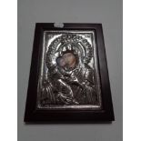 A continental silvered religious Icon in frame.