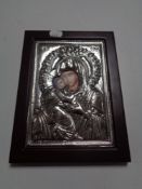 A continental silvered religious Icon in frame.