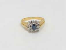 An 18ct gold sapphire and diamond cluster ring, size M CONDITION REPORT: 3.