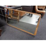 A mid 20th century dressing table mirror on teak board