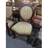 An antique mahogany balloon back chair