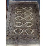 A fringed Eastern rug of geometric design