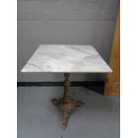 A Victorian cast metal based marble topped table