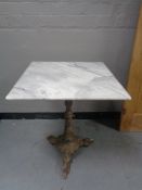 A Victorian cast metal based marble topped table