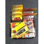 A tray of fourteen boxed die cast vehicles including Shell and Maisto sports car,