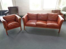 A late 20th century Danish beech framed three seater settee and matching armchair