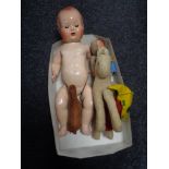 A box of twentieth century dolls, soft toys, miniature leather horse,