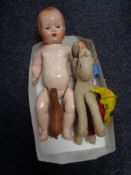 A box of twentieth century dolls, soft toys, miniature leather horse,