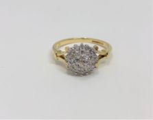 An 18ct gold diamond cluster ring, size K CONDITION REPORT: 3.